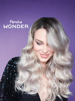 Зареди изображението в галерията, Модел с вълниста коса, използваща Fanola WONDER, позира на лилав фон.