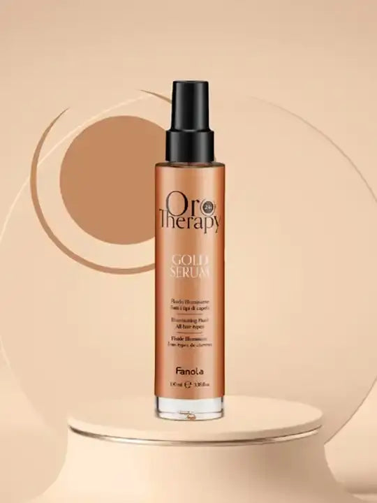 Oro therapy gold hydrating serum bottle on a minimalistic display, highlighting its moisturizing and shine enhancing properties